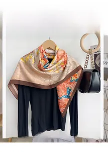 Detail view of the soft oil painting style printed square scarf with brown border finish