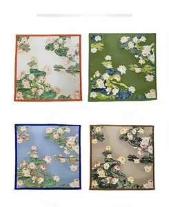 Four color options of floral print silk scarves featuring traditional lotus artwork
