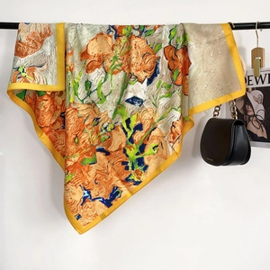Artistic oil painting floral silk scarf with yellow border draped over a black rack