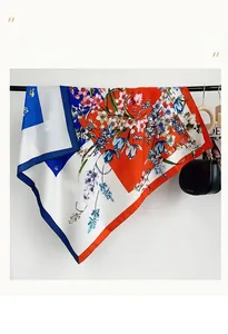 Detail of floral silk scarf with bold red and blue color block design and vibrant tulips