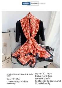 Macro shot of red satin scarf with golden floral patterns and 90x180cm size details