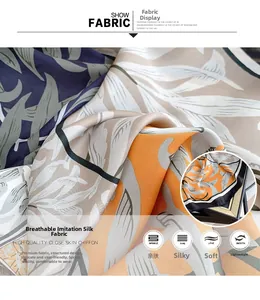 Macro detail of silky chiffon fabric with orange and navy leaf patterns on neck scarf