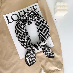Elegant houndstock pattern velvet scarf displayed in a stylish knotted arrangement