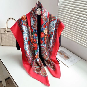 Detailed close-up of a large red ethnic style floral shawl with paisley patterns
