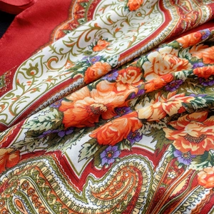 Ethnic paisley and rose print scarf in vibrant red, featuring silk-like soft fabric