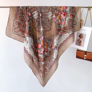 Detail of vintage paisley and rose floral print on a silky square scarf wrap shawl