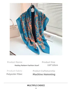 Detail of 110x110cm blue paisley scarf showing floral patterns and machine hemmed edges