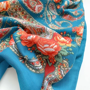 Close-up of paisley pattern and floral print on soft twill weave blue shawl wrap