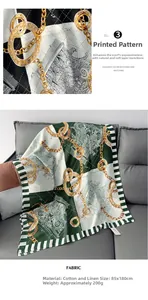 Detail view of cotton linen scarf showing emerald chain print and 85x180cm dimensions
