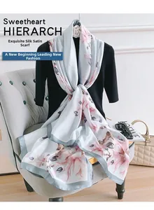 Detail showing the floral print and satin texture of this blue long scarf for women