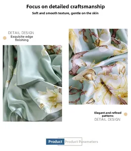 Detail of mint green silk scarf with white magnolia print and soft satin luster