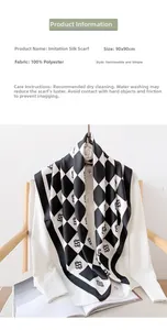 Detailed close-up of 90x90cm black and white checkered faux silk scarf with logo pattern