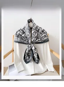 Detail showing 100% polyester scarf with black and white abstract graffiti print on shirt