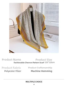 Close-up of geometric pattern scarf with bright yellow border and 110cm size tag
