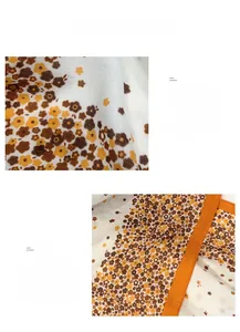 Detailed macro view of floral print fabric with orange ribbon edge on autumn scarf