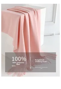 Detail of pink long tassel scarf showing soft 100% polyester brushed fabric texture