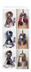 Detail of multi-color houndstooth cashmere-feel scarves with fringe in a six-grid layout