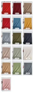 Collage of thick imitation cashmere scarves in sixteen vibrant solid colors with tassels