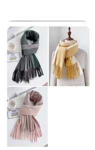 Macro detail of bicolour knit scarves with fringe tassels in teal, yellow, and pink colors