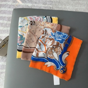 Set of three luxury floral square scarves with tassel edges in orange and beige prints