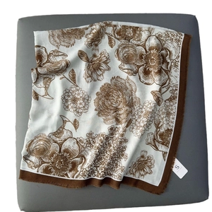 Classic floral print shawl with retro camellia pattern and fringed edges in beige and brown