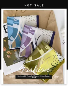 Detail of silk-like square scarves with abstract geometric prints on brown shirt