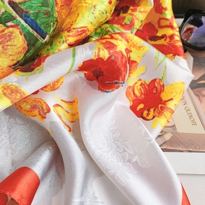 Close-up of silky red floral pattern scarf with exquisite jacquard texture and satin finish