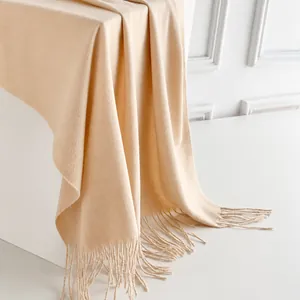 Thick beige winter scarf with long tassels and soft cashmere-like texture for women