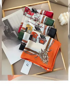 Detailed equestrian print silk scarf collection featuring classic carriage and chain patterns