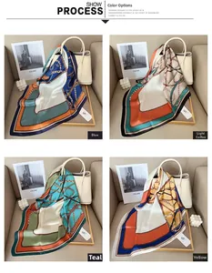 Close-up of geometric silk scarf with fringe tassel available in blue, teal, and khaki colors