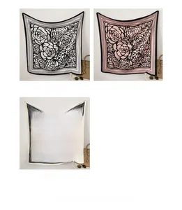 Close-up of square floral silk scarf with large camellia pattern and striped border edge