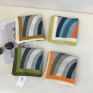 Set of four 68cm printed square scarves featuring geometric patterns and velvet texture