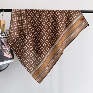 Brown herringbone geometric print silk satin square scarf draped on a display rack