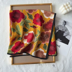 Elegant mustard yellow cotton-feel scarf with vintage floral print and black border finish