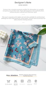 Detail view of 60x60cm blue floral silk scarf with machine-rolled hem and care instructions