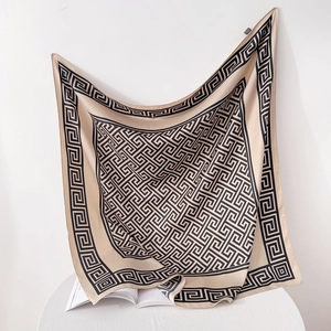 Elegant 90cm square silk scarf featuring a beige base with black meander geometric patterns