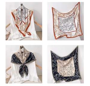 Detailed view of square silk scarf with floral prints and soft elegant texture