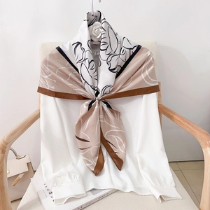 Elegant silk scarf with brown and white abstract floral print and camellia accessory