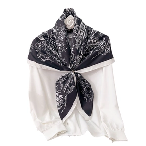 Elegant 90cm black and white floral print silk scarf styled on a white chiffon shirt