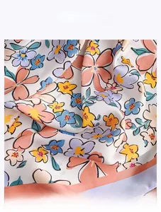 Close-up of vintage floral faux silk scarf showing soft texture and drapes