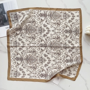 Detail of silk-texture square scarf with baroque patterns and dark brown border