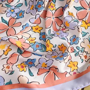 Elegant floral silk satin square scarf featuring multi-color flower prints on white base