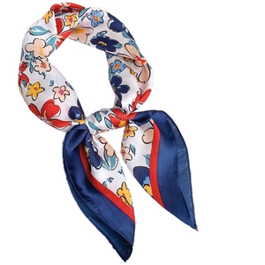 Floral print silk scarf with blue and red abstract patterns on white background