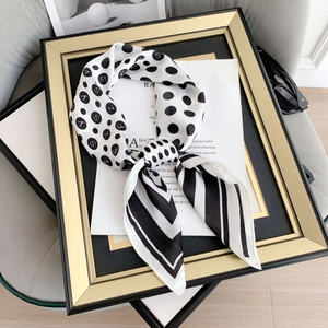Elegant black and white polka dot silk scarf with letter print on a decorative frame