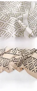 Close-up detail of geometric silk scarf showing refined edge locking process and fabric texture