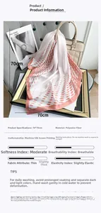 Detailed view of 70x70cm polyester silk scarf with contrast polka dots on a stylish handbag