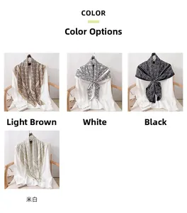 Detailed views of silk scarves with geometric patterns in light brown, black, and white