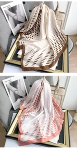 Detail of satin silk scarves featuring polka dot patterns in champagne and coral tones