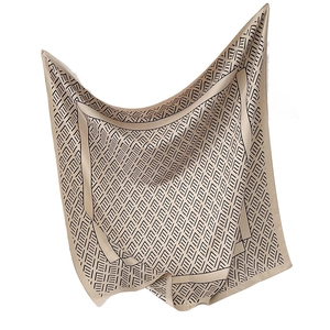 Elegant champagne silk square scarf with black geometric patterns and draped texture
