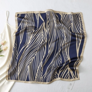 Elegant navy blue and champagne silk-like scarf with abstract vein patterns for women